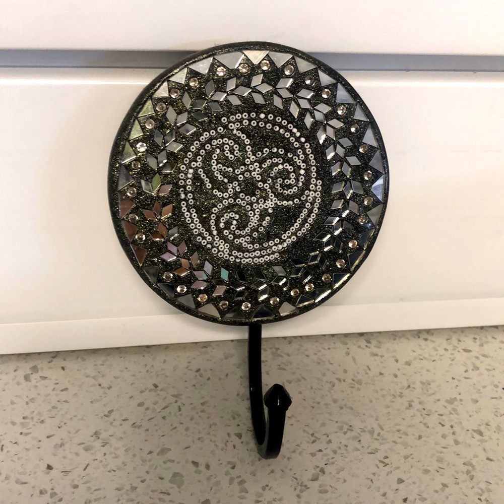 Beautiful, mirrored wall hook. Originally from India.